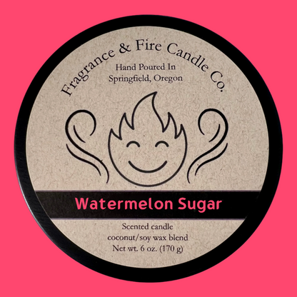 Hot pink colored background with round candle top and brown label. Name of the candle on the label is Watermelon Sugar.